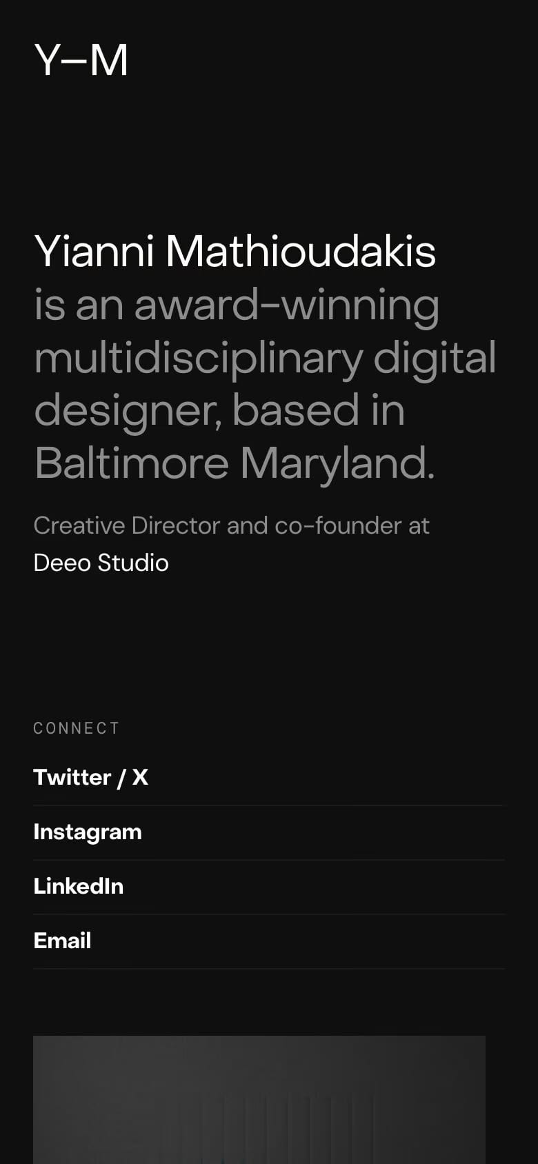 Yianni Mathioudakis — mobile screenshot of a dark design portfolio site in black and white